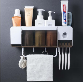 Toothbrush holder for toilet storage